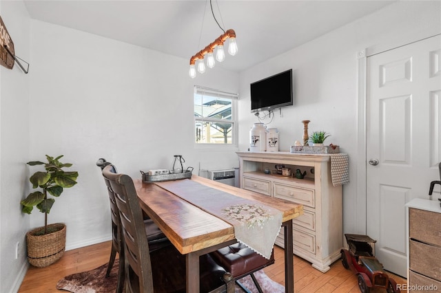 dining area featuring light wood-type flooring