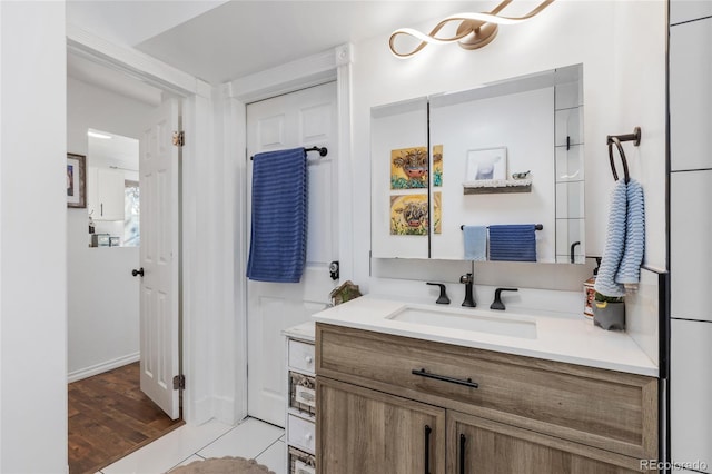 bathroom featuring vanity and hardwood / wood-style flooring