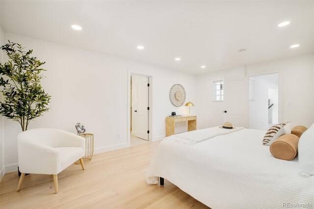 bedroom featuring recessed lighting, light wood finished floors, and baseboards