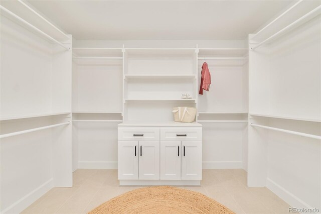 spacious closet featuring light tile patterned floors
