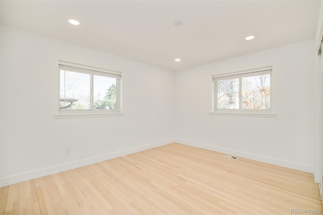 621 S Harrison Ln, Denver, CO 80209 - unfurnished room featuring plenty of natural light, wood finished floors, baseboards, and recessed lighting