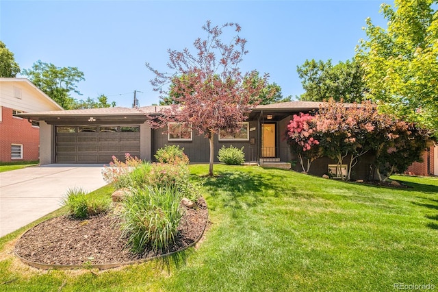 621 S Harrison Ln, Denver, CO 80209 - view of front of property featuring concrete driveway, an attached garage, and a front lawn