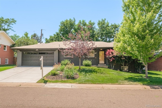 621 S Harrison Ln, Denver, CO 80209 - view of front of house with a garage, driveway, and a front yard