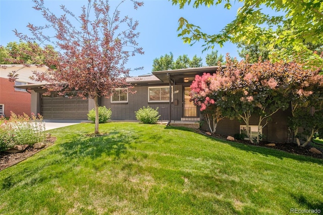 621 S Harrison Ln, Denver, CO 80209 - view of front of house featuring a garage, a front yard, and concrete driveway