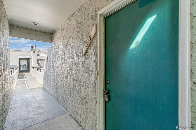 view of exterior entry with stucco siding