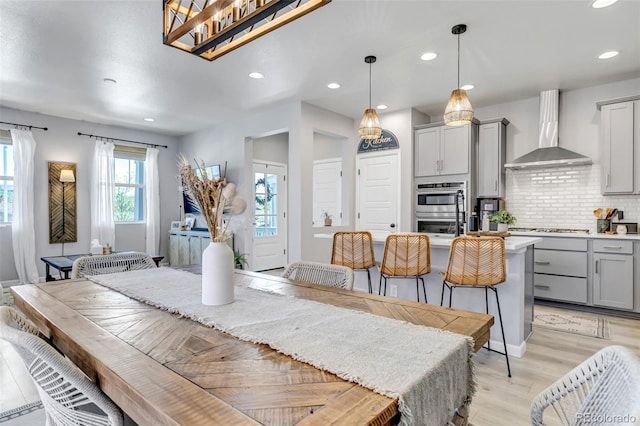 8049 Monte Vista Cir, Littleton, CO 80125 - dining area featuring recessed lighting, light wood-type flooring, and baseboards