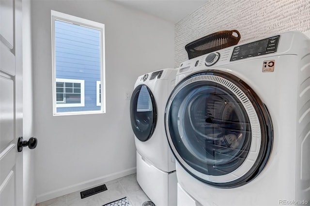 8049 Monte Vista Cir, Littleton, CO 80125 - washroom with washer and clothes dryer and baseboards