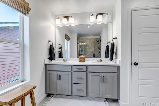 8049 Monte Vista Cir, Littleton, CO 80125 - bathroom with a shower stall, baseboards, and double vanity