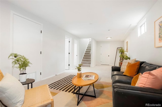 1205 W 101st Ave, Northglenn, CO 80260 - living area with stairway, light colored carpet, and baseboards