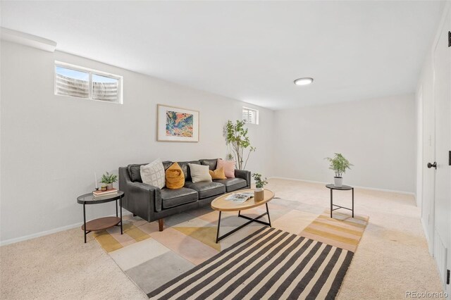 1205 W 101st Ave, Northglenn, CO 80260 - living area with healthy amount of natural light, light carpet, and baseboards