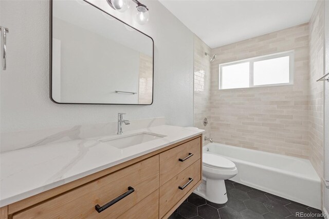 1205 W 101st Ave, Northglenn, CO 80260 - full bath with toilet, washtub / shower combination, vanity, and tile patterned floors