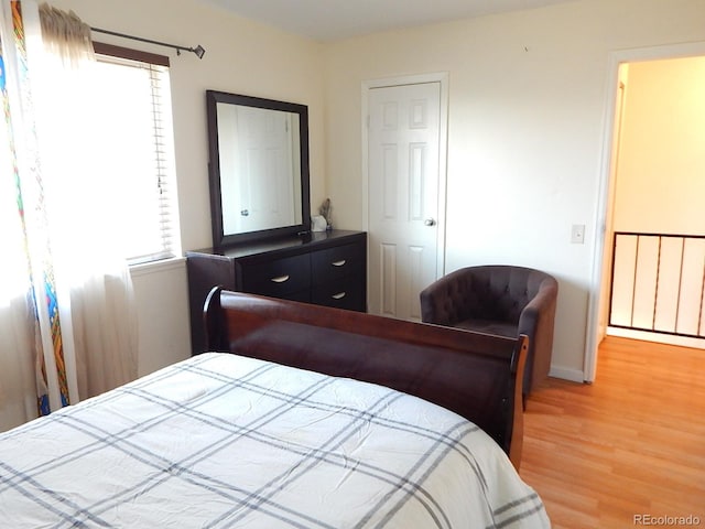 bedroom featuring light wood-style floors