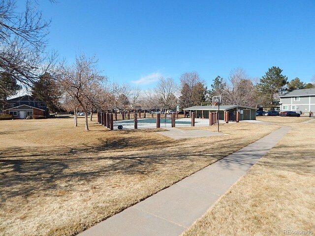 view of home's community featuring community basketball court