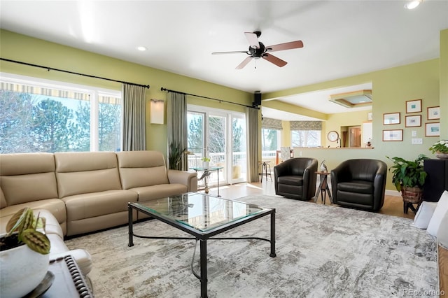 living room with plenty of natural light, recessed lighting, and ceiling fan