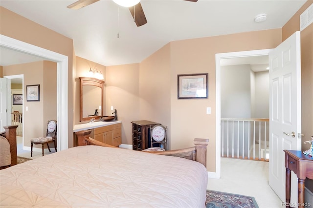 carpeted bedroom with a ceiling fan and baseboards