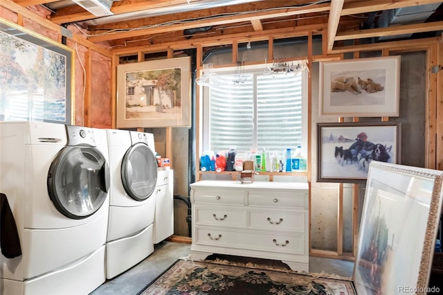 laundry area with plenty of natural light and separate washer and dryer