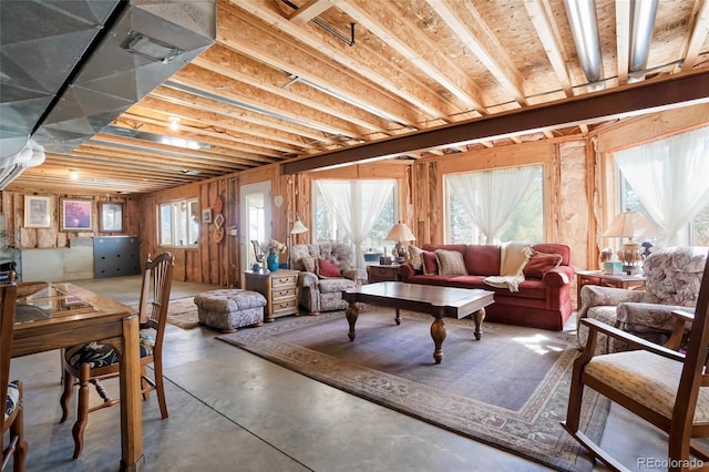 living area with finished concrete floors and plenty of natural light