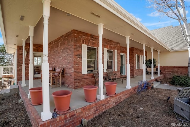 view of patio featuring visible vents and covered porch