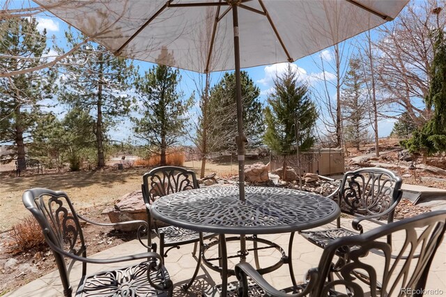 view of patio featuring outdoor dining area