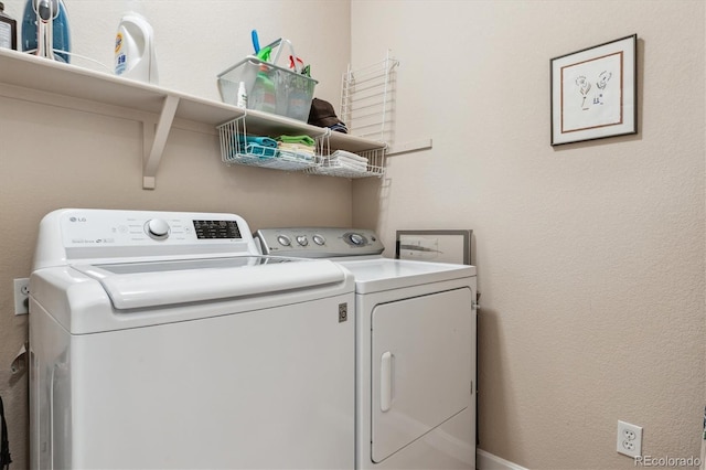 clothes washing area with laundry area and independent washer and dryer