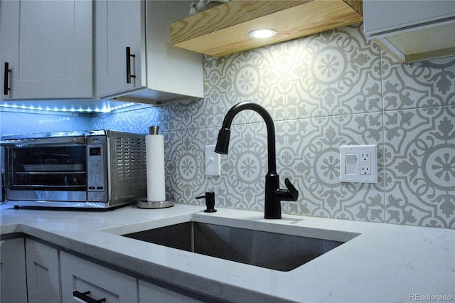 650 S Clinton St Unit 2A, Denver, CO 80247 - kitchen view of tasteful backsplash and light stone counters