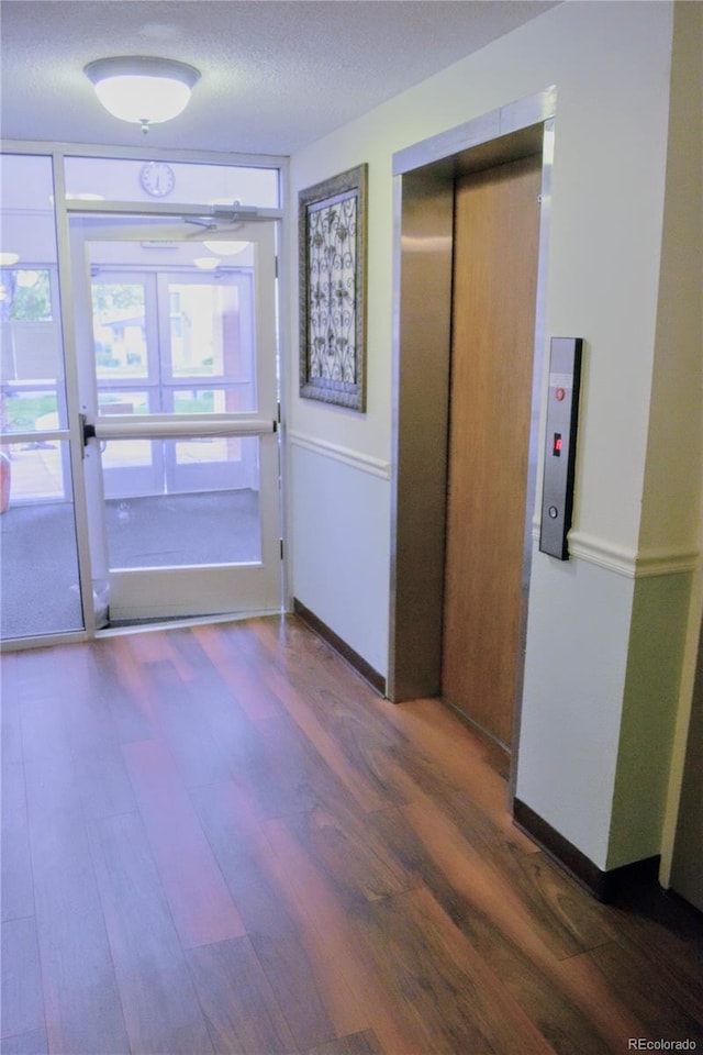 650 S Clinton St Unit 2A, Denver, CO 80247 - corridor with wood finished floors and baseboards