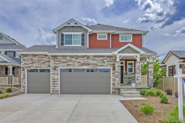 21900 E 46th Pl, Aurora, CO 80019 - craftsman house with concrete driveway, board and batten siding, and stone siding