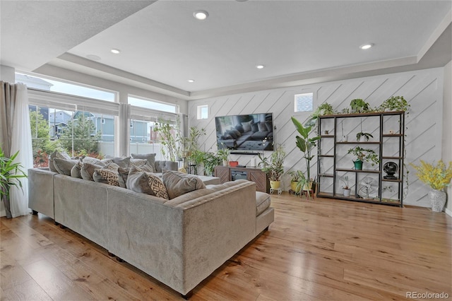 21900 E 46th Pl, Aurora, CO 80019 - living area with a raised ceiling, hardwood / wood-style flooring, recessed lighting, and wooden walls