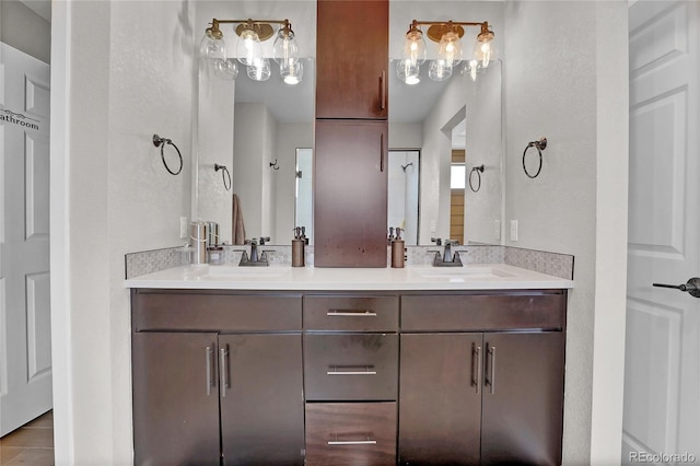 21900 E 46th Pl, Aurora, CO 80019 - full bathroom featuring double vanity and tile patterned floors