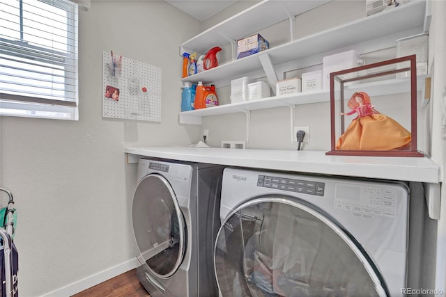 21900 E 46th Pl, Aurora, CO 80019 - washroom featuring washer and dryer, baseboards, and dark wood-style floors
