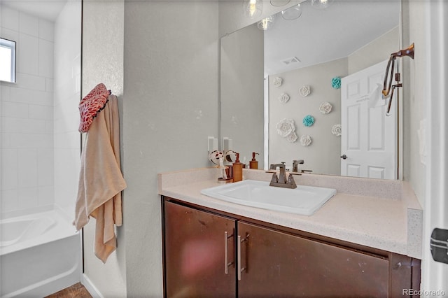 21900 E 46th Pl, Aurora, CO 80019 - bathroom with vanity and tub / shower combination