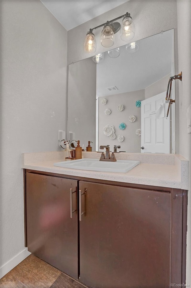 21900 E 46th Pl, Aurora, CO 80019 - bathroom featuring vanity and baseboards