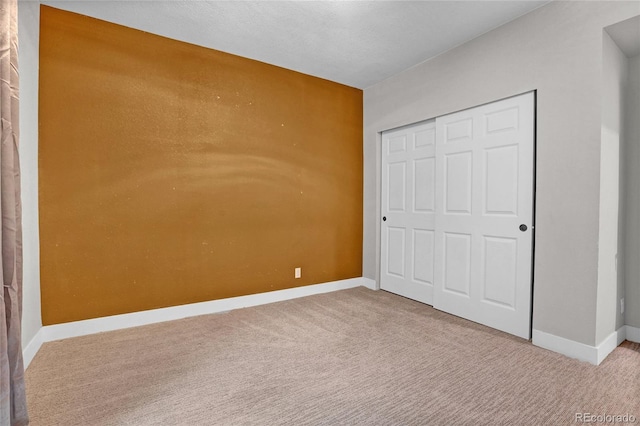 21900 E 46th Pl, Aurora, CO 80019 - unfurnished bedroom featuring carpet, a closet, and baseboards