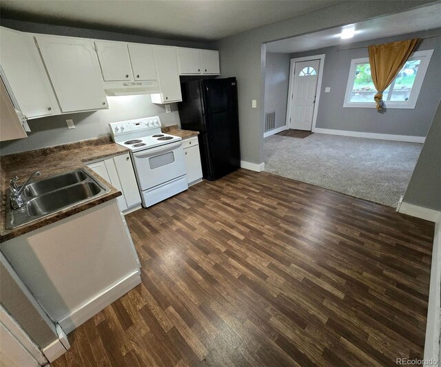 520 Prairie Rd, Colorado Springs, CO 80909 - kitchen with white electric range oven, freestanding refrigerator, a sink, under cabinet range hood, and white cabinets