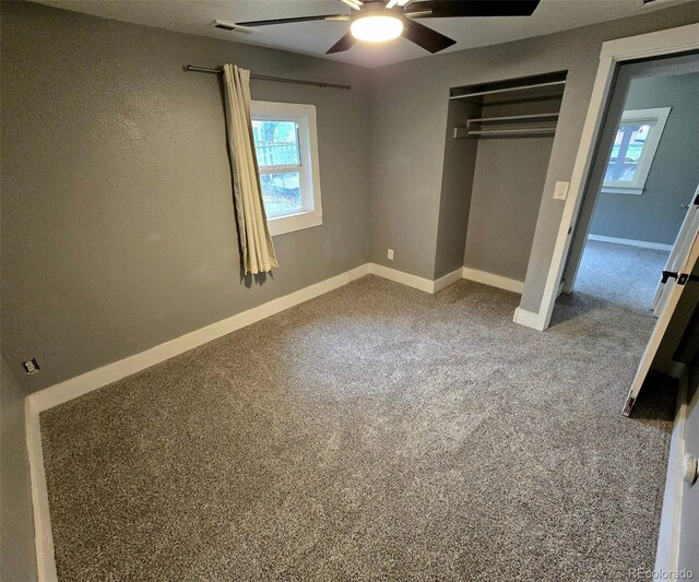 520 Prairie Rd, Colorado Springs, CO 80909 - unfurnished bedroom with multiple windows, baseboards, a closet, and carpet floors