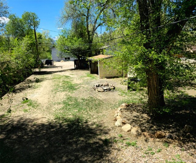 520 Prairie Rd, Colorado Springs, CO 80909 - view of yard featuring an outdoor structure