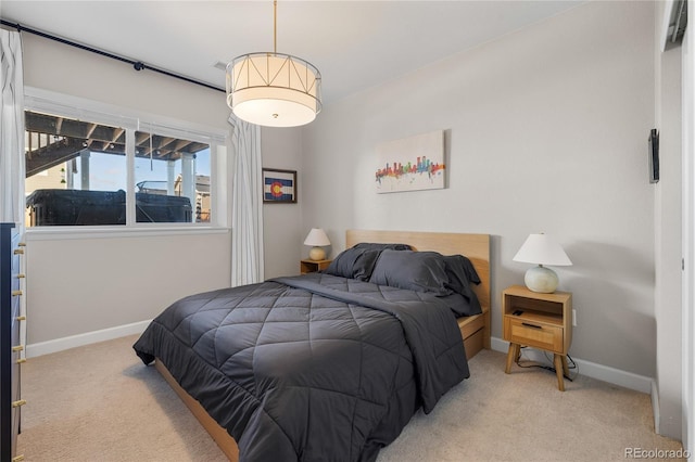 carpeted bedroom featuring an AC wall unit