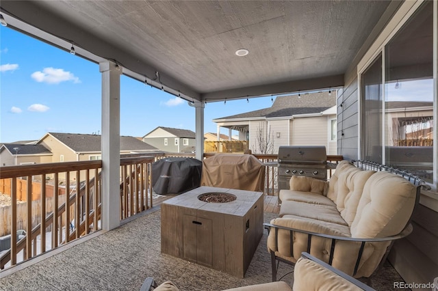 view of patio featuring an outdoor living space with a fire pit and area for grilling