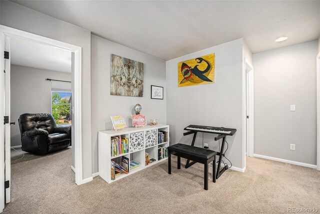 corridor with carpet and baseboards