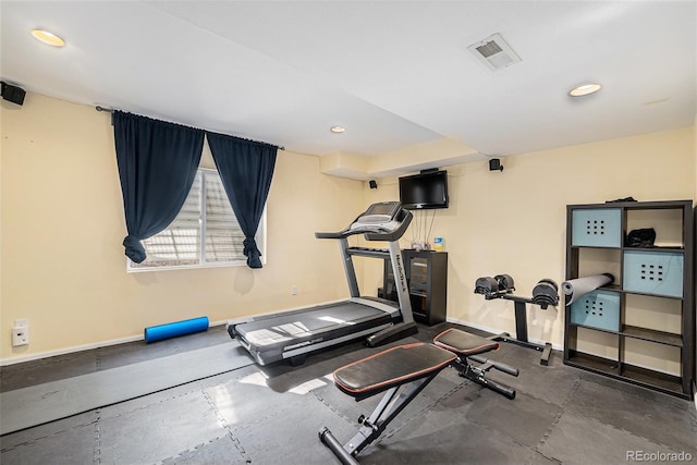workout area with baseboards and recessed lighting