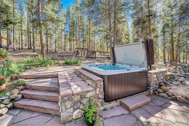 view of patio with a hot tub