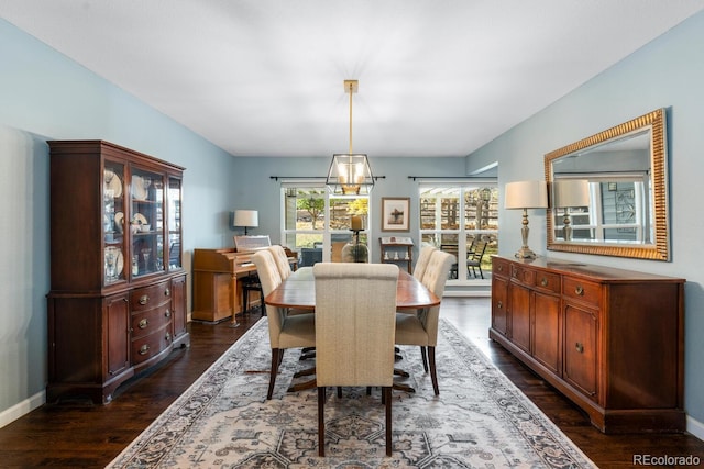 dining room with dark hardwood / wood-style flooring