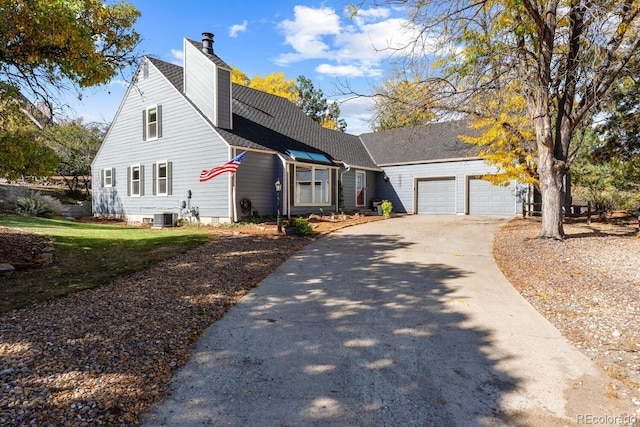 view of front of property with central AC unit and a garage