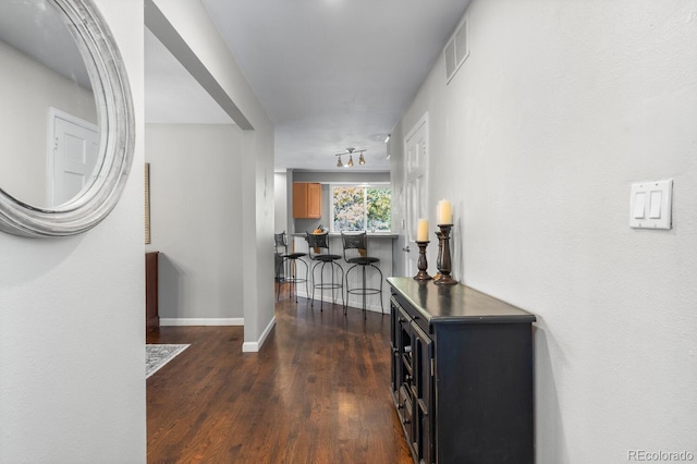 hall with dark wood-type flooring