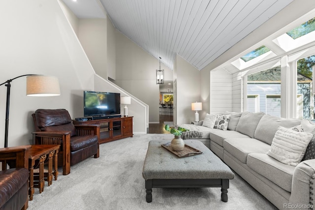 living room featuring wood ceiling, light colored carpet, and lofted ceiling with skylight