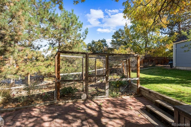 wooden terrace featuring a lawn