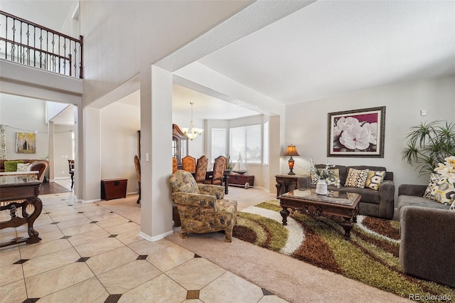 living room with light tile patterned floors and a chandelier