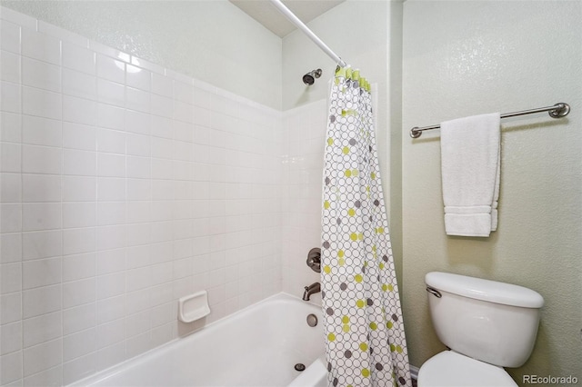 bathroom featuring toilet and shower / tub combo with curtain