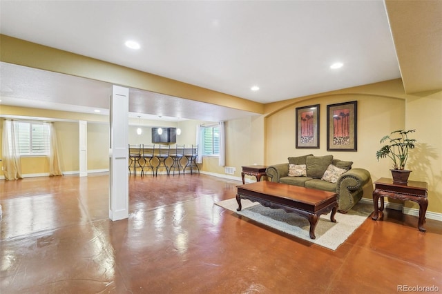 living room with concrete floors