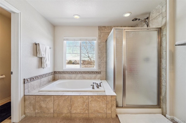 full bathroom featuring a shower stall and a bath